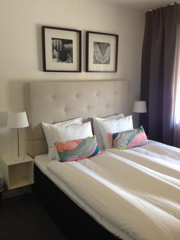 Postel nebo postele na pokoji v ubytování Hotell Tinget