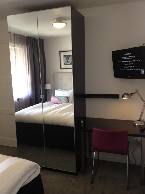 Postel nebo postele na pokoji v ubytování Hotell Tinget