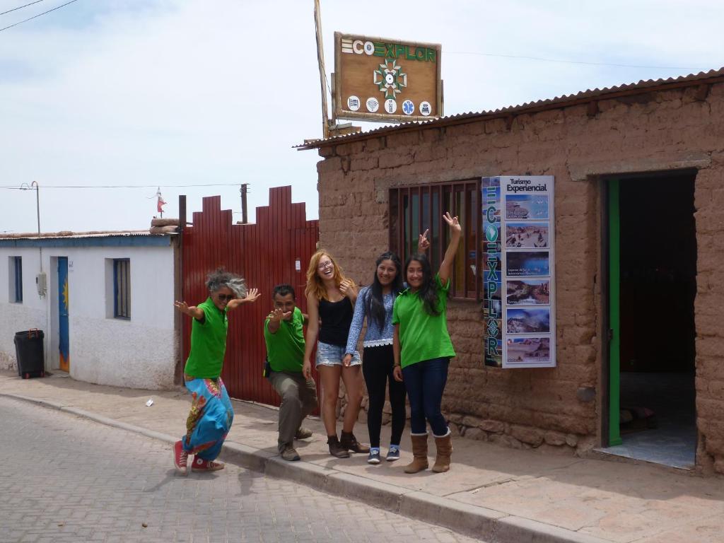 a group of girls standing next to a building at La Casa EcoExplor in San Pedro de Atacama