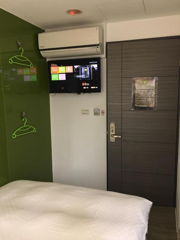 Postel nebo postele na pokoji v ubytování T.O. Hotel Chengde