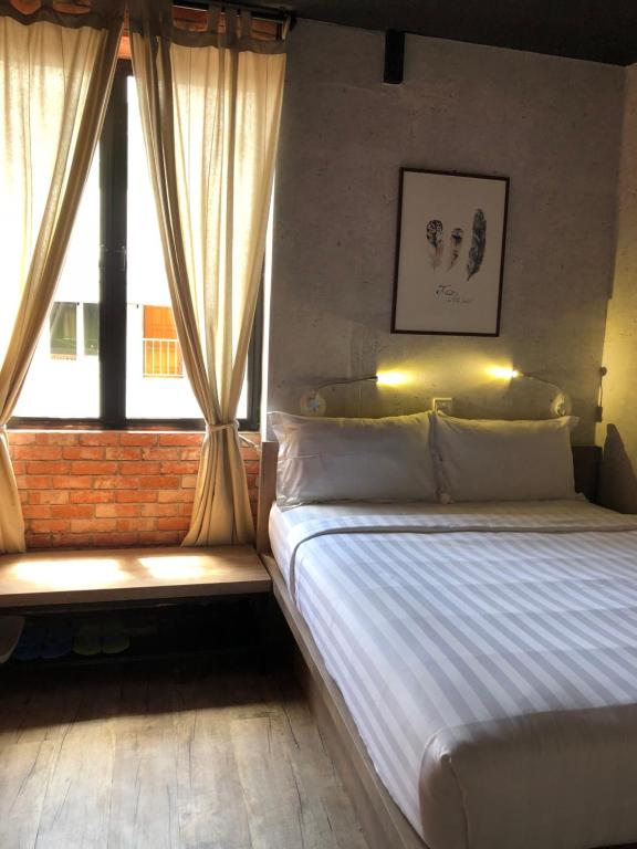 Postel nebo postele na pokoji v ubytování Cube Bed Station & Tours Sdn Bhd