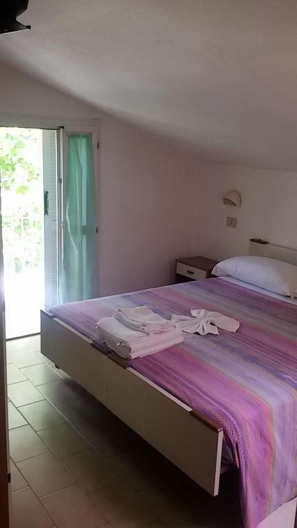 Postel nebo postele na pokoji v ubytování Hotel Elisabetta 2 stelle