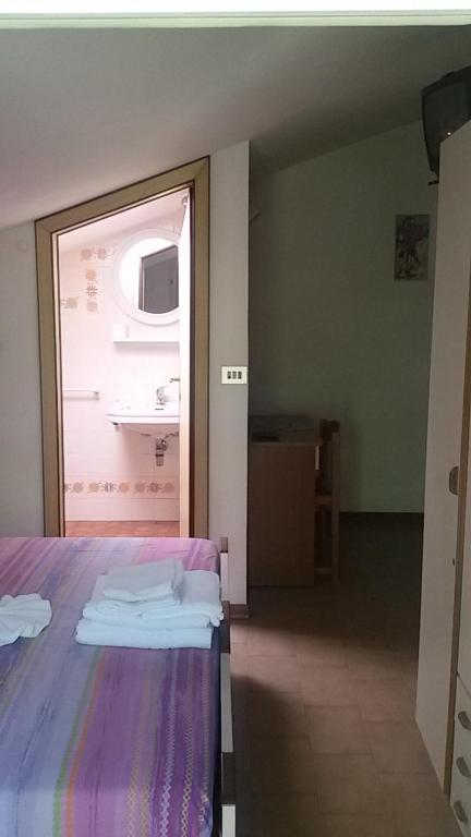 Postel nebo postele na pokoji v ubytování Hotel Elisabetta 2 stelle