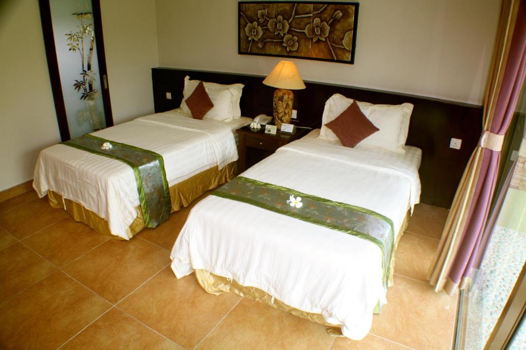Postel nebo postele na pokoji v ubytování Beringgis Beach Resort & Spa