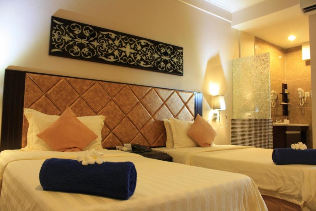 Postel nebo postele na pokoji v ubytování Beringgis Beach Resort & Spa