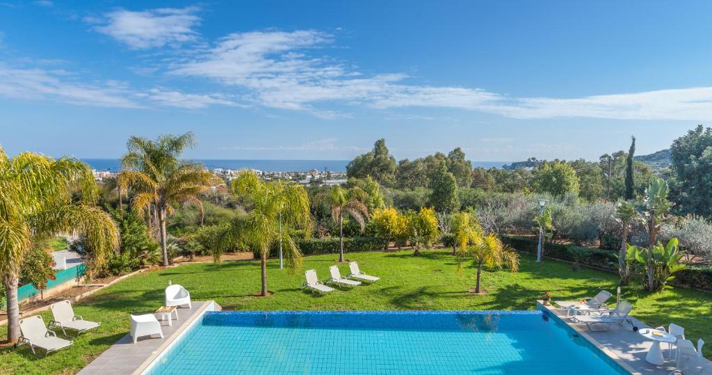 an aerial view of a resort with a swimming pool at Myrtiana Villa in Protaras