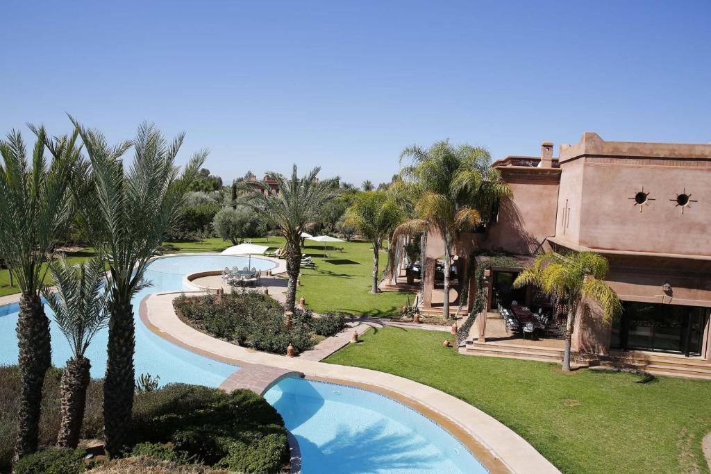 an aerial view of a resort with a swimming pool at Villa Grace in Marrakesh