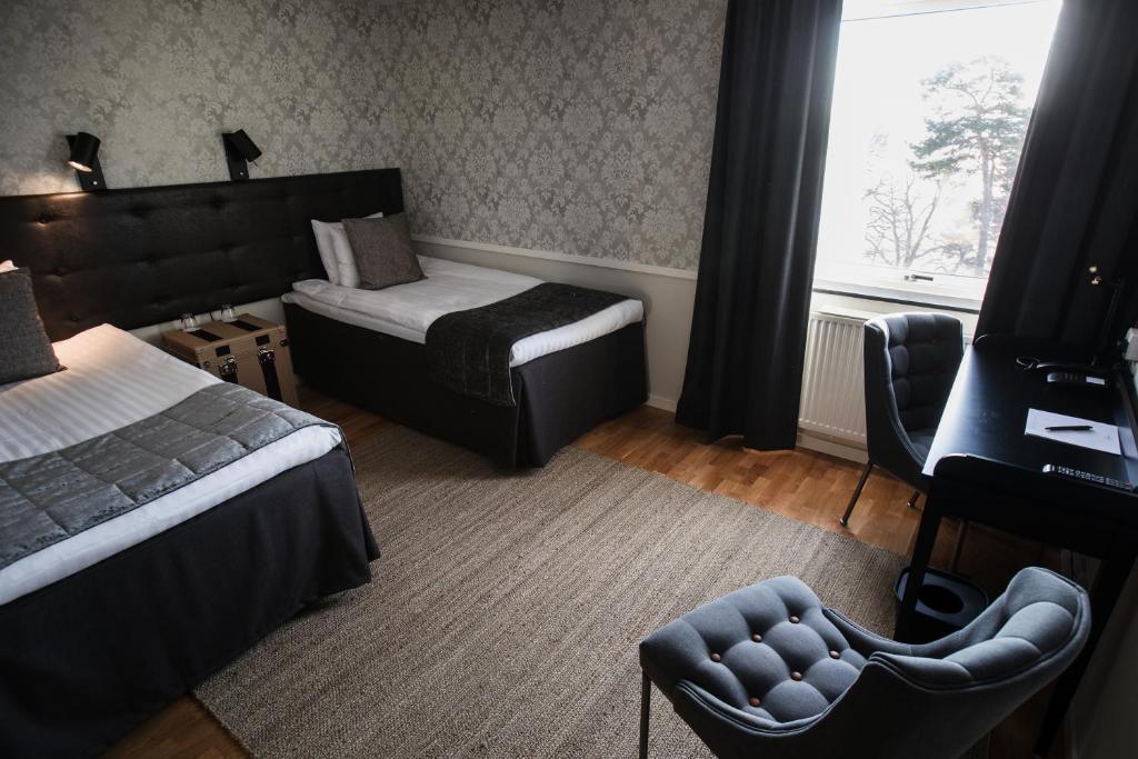Postel nebo postele na pokoji v ubytování Bergendal