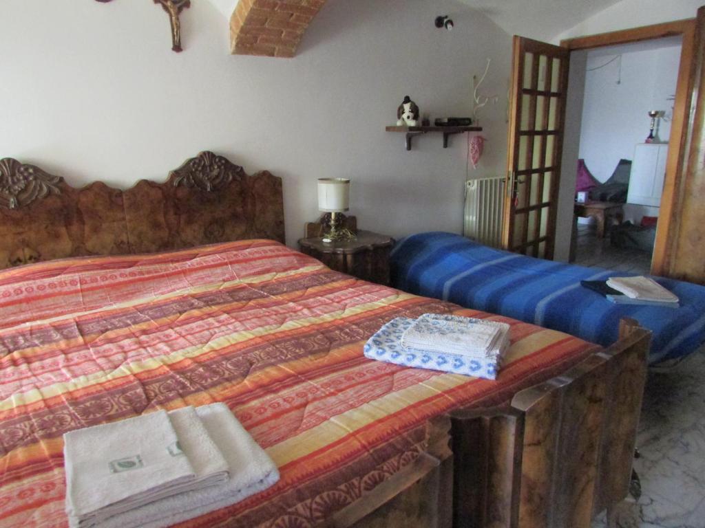 Postel nebo postele na pokoji v ubytování La Terrazza Mombarone