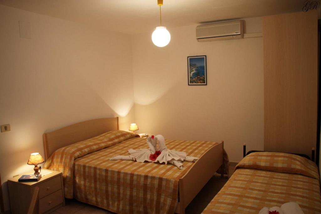 Postel nebo postele na pokoji v ubytování Hotel L'Ancora