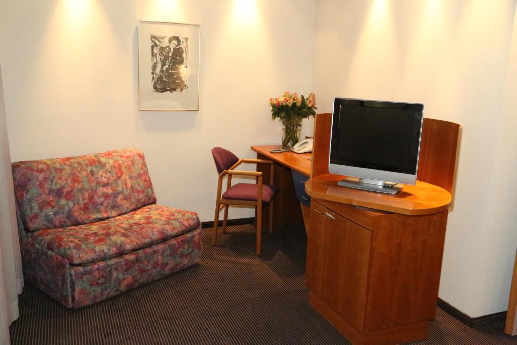 TV a/nebo společenská místnost v ubytování Prielmayerhof HOTEL
