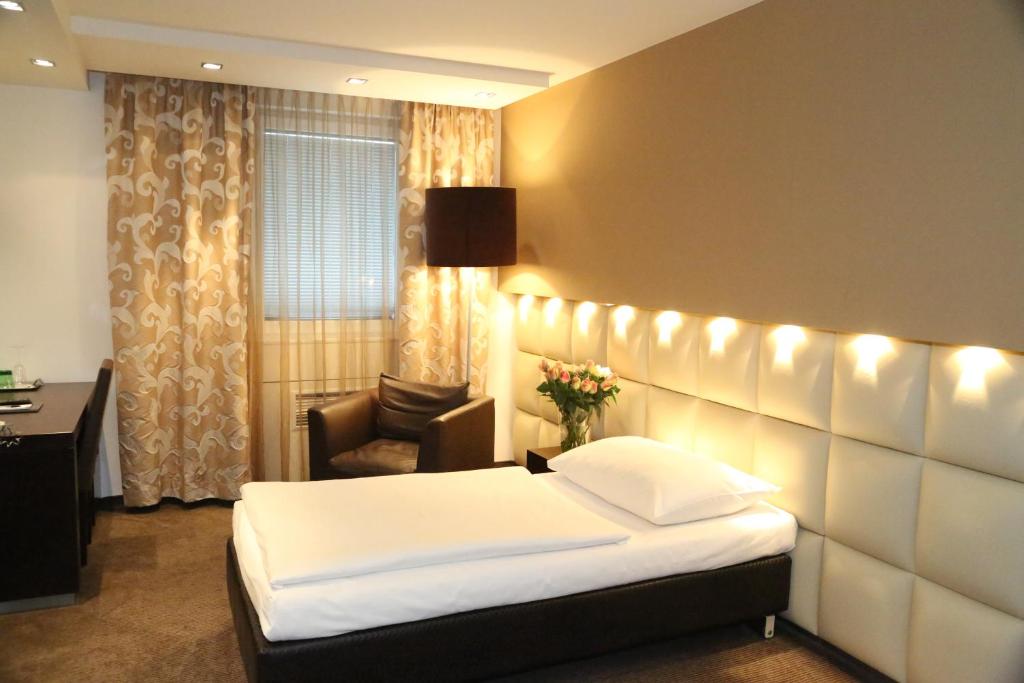 Postel nebo postele na pokoji v ubytování Prielmayerhof HOTEL