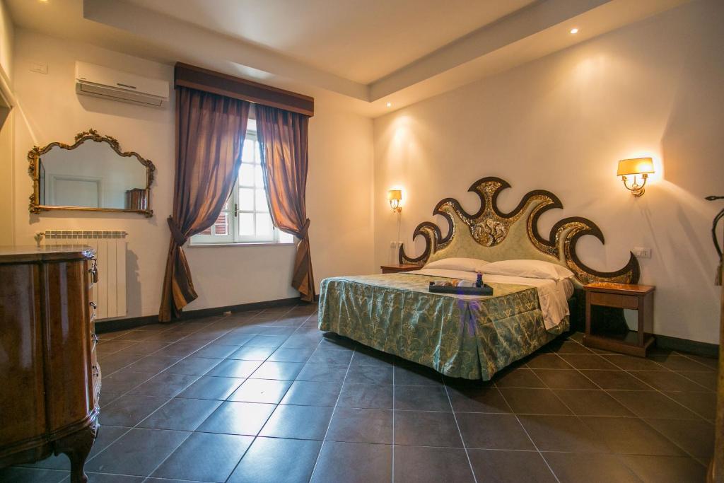 Postel nebo postele na pokoji v ubytování Hotel Quadrifoglio Roma Eur