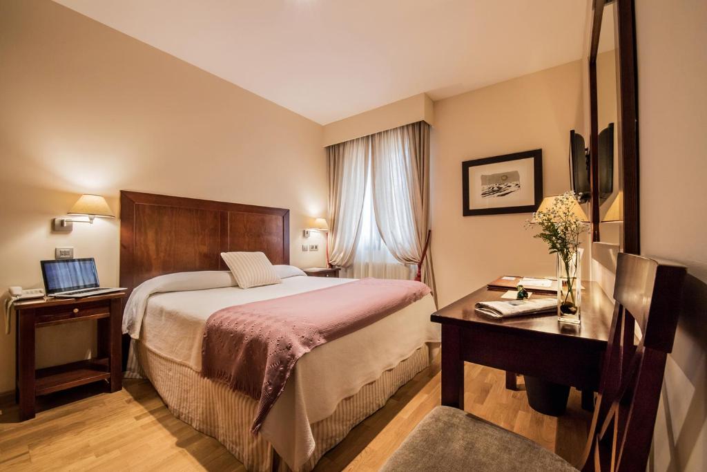 Postel nebo postele na pokoji v ubytování Hotel Villa Virginia