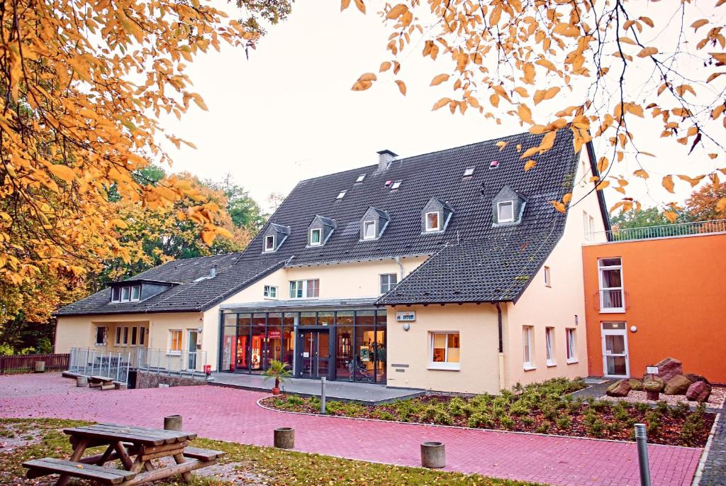 a building with a picnic table in front of it at Jugendherberge Detmold in Detmold
