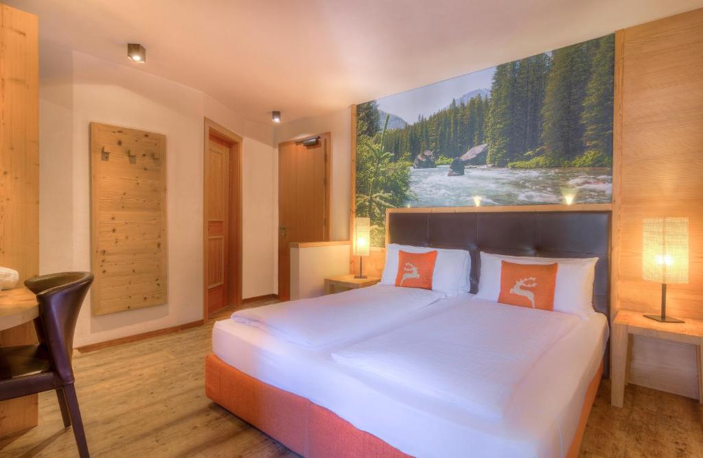 Postel nebo postele na pokoji v ubytování Hotel Madonnina Resort And Wellness