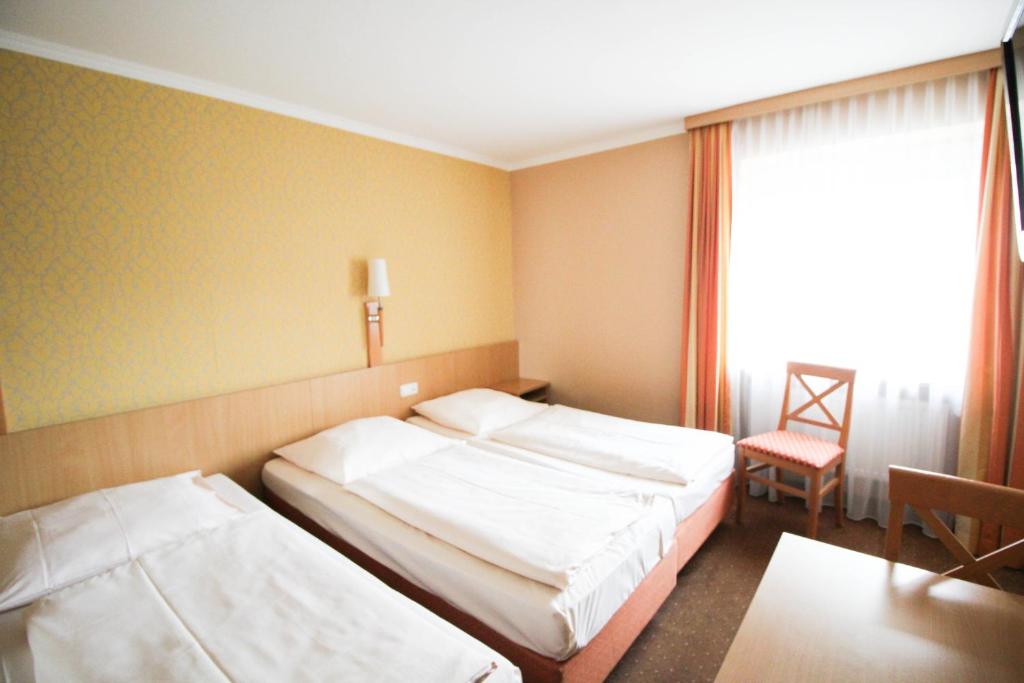 Postel nebo postele na pokoji v ubytování Jagerhof