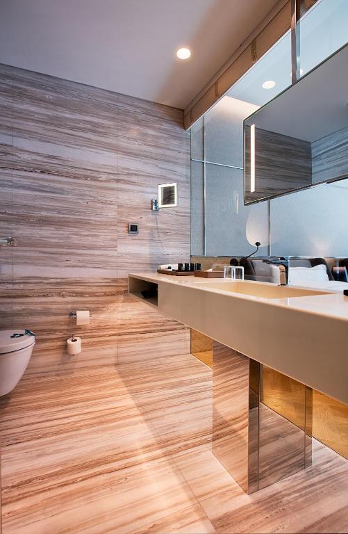 a bathroom with a sink and a mirror at Fer Hotel in Istanbul