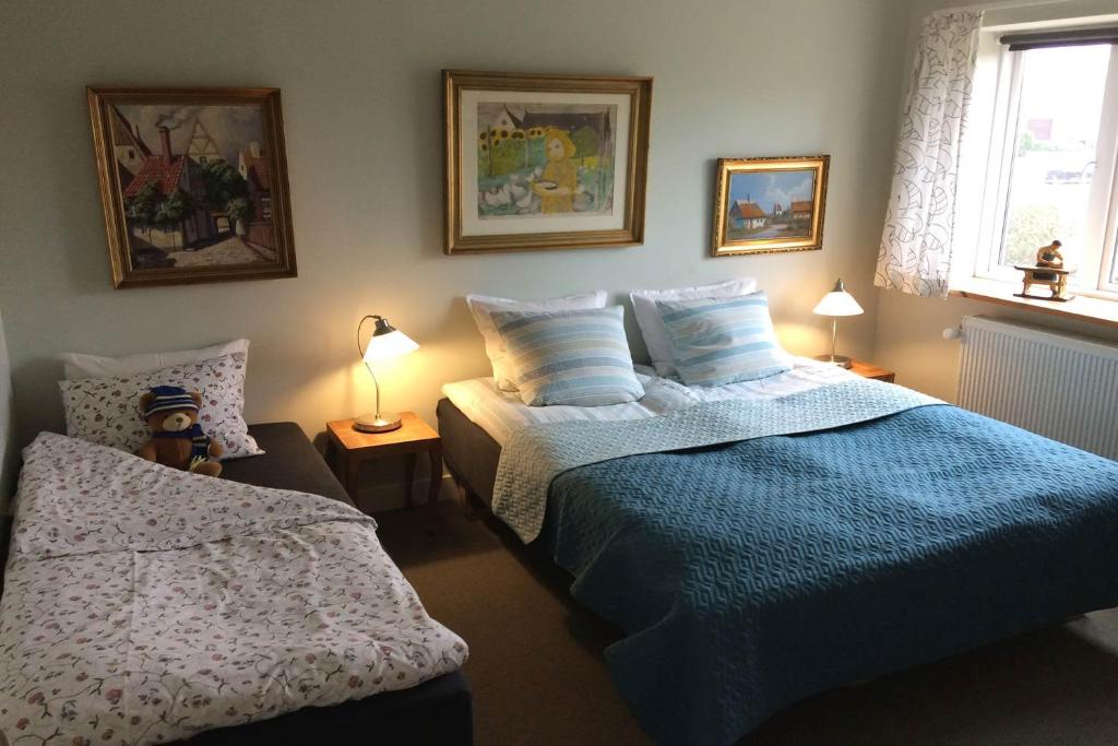 Postel nebo postele na pokoji v ubytování Hotel Lolland
