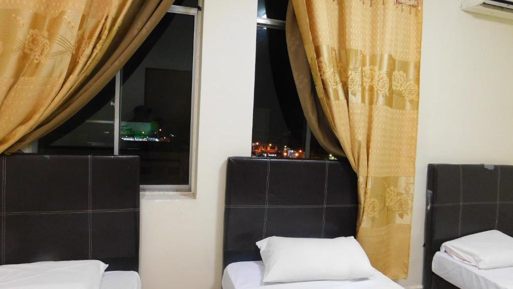 Postel nebo postele na pokoji v ubytování Hotel Ocean