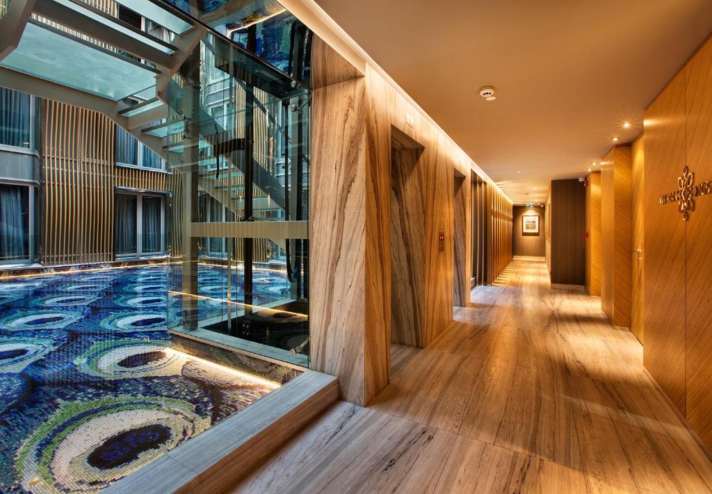 a hallway with a mosaic floor in a building at Fer Hotel in Istanbul