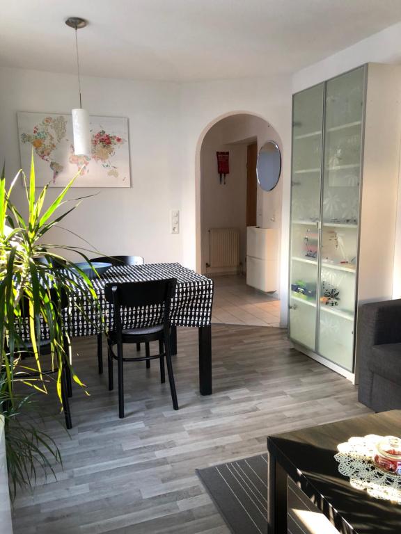 a dining room with a table and chairs in a room at Apartment Gisi in Innsbruck