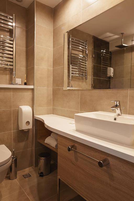 Koupelna v ubytování IG Hotel