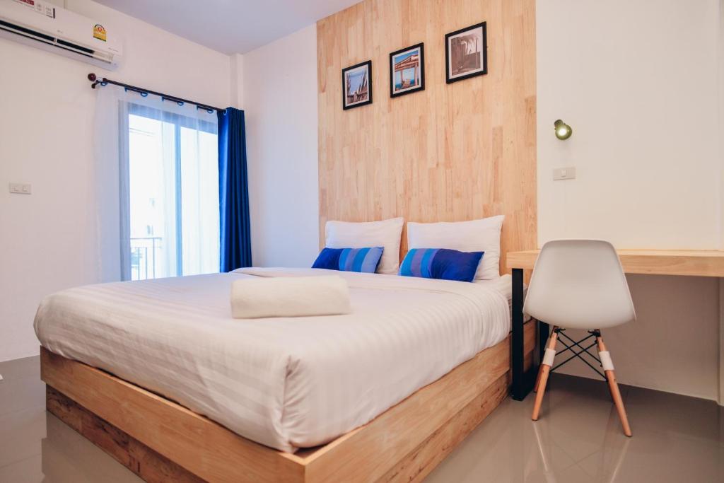 Postel nebo postele na pokoji v ubytování The Cozy Hotel