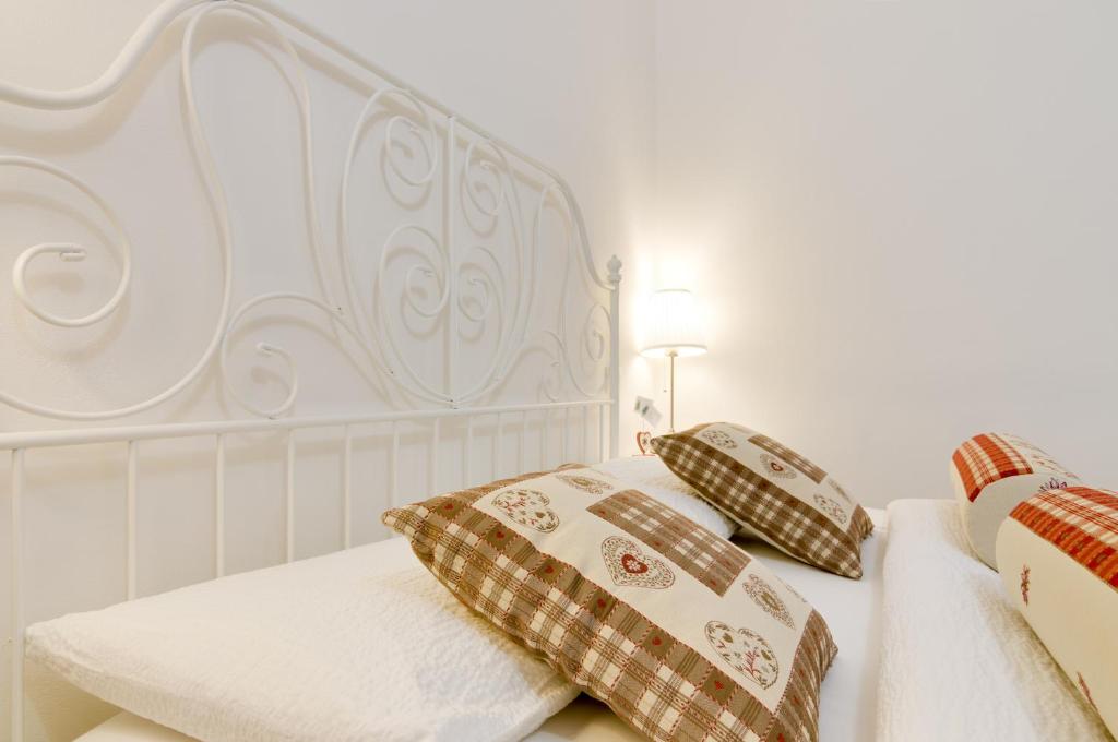 Letto o letti in una camera di B&B and Apartments Al Duomo