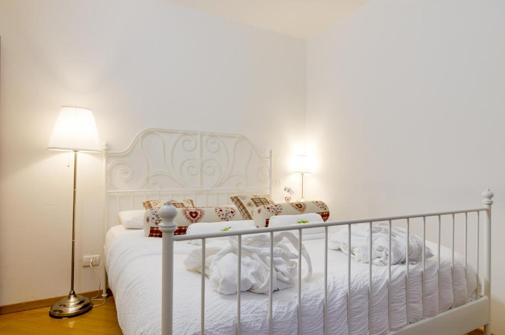 Letto o letti in una camera di B&B and Apartments Al Duomo