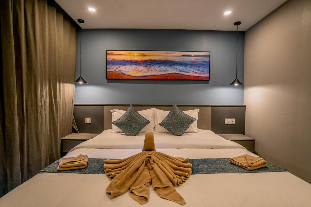 a bedroom with a bed with a towel on it at Sara Resort in Koh Rong Sanloem