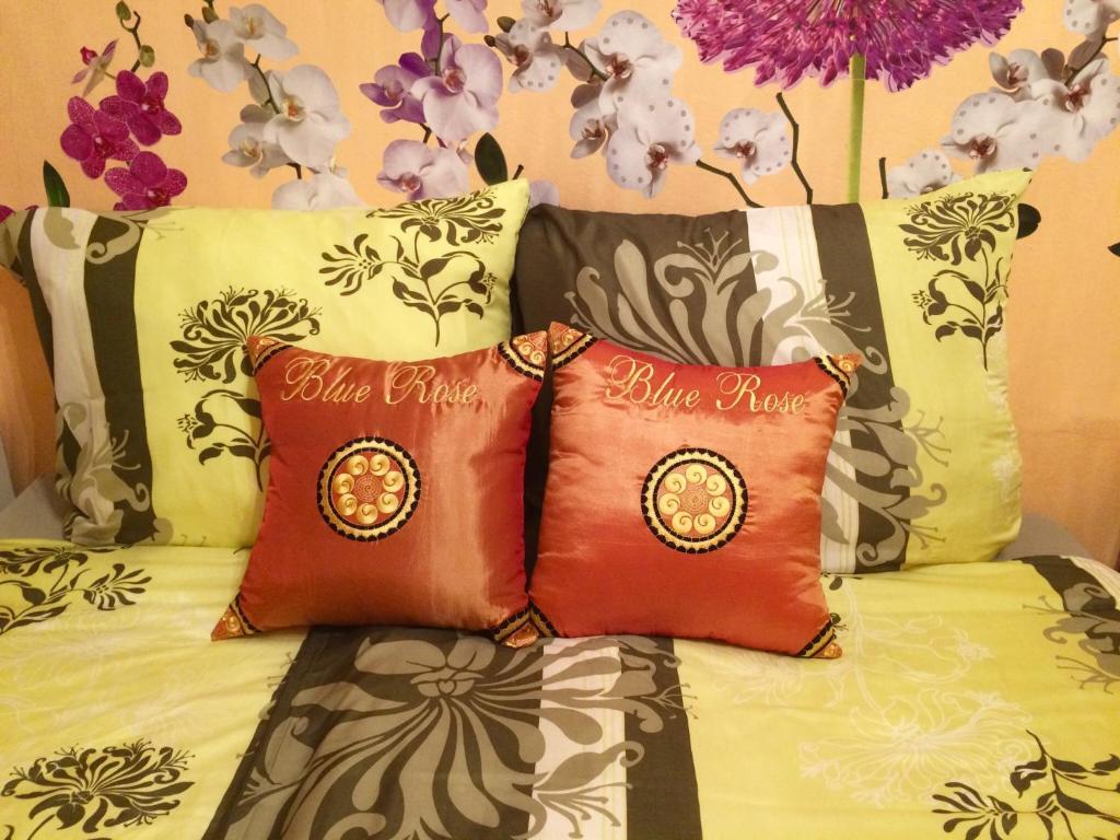 Postel nebo postele na pokoji v ubytování Blue Rose Apartman