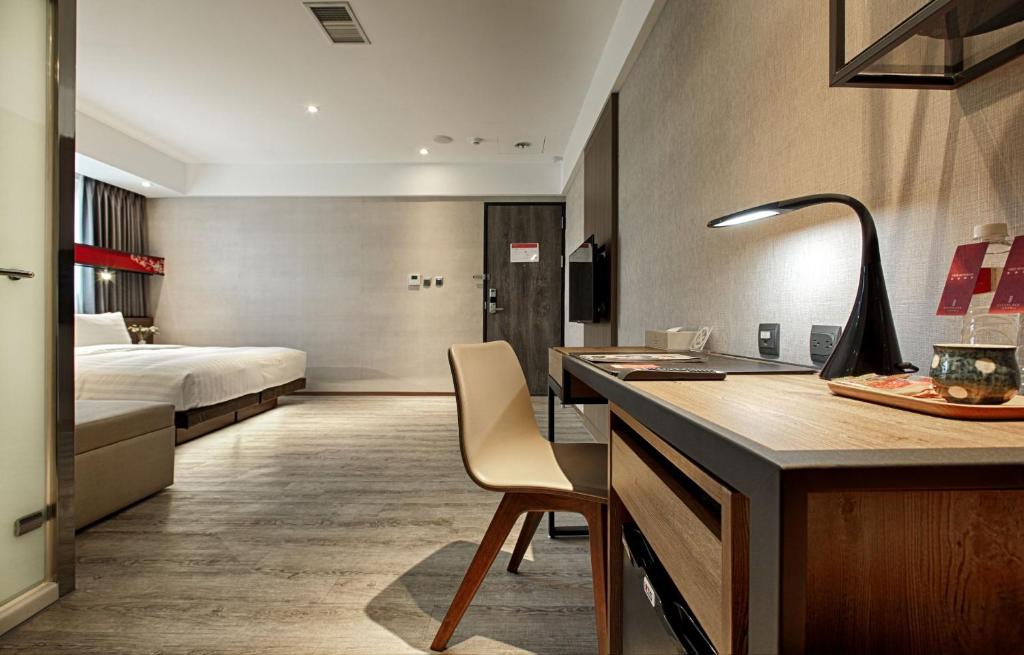 Postel nebo postele na pokoji v ubytování City Place Hotel