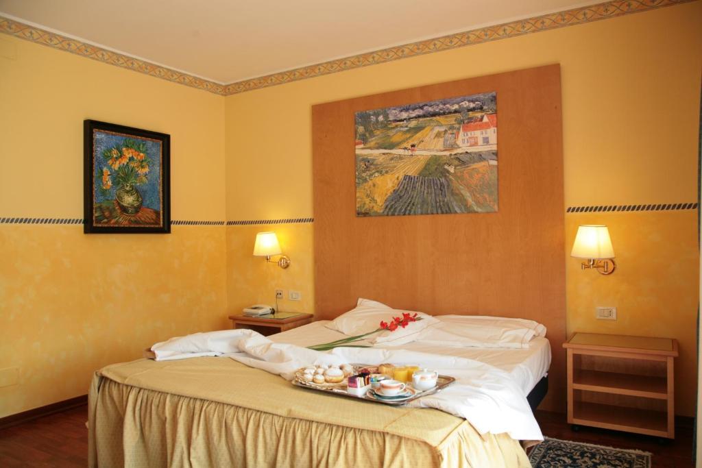 Posteľ alebo postele v izbe v ubytovaní Hotel Al Ponte
