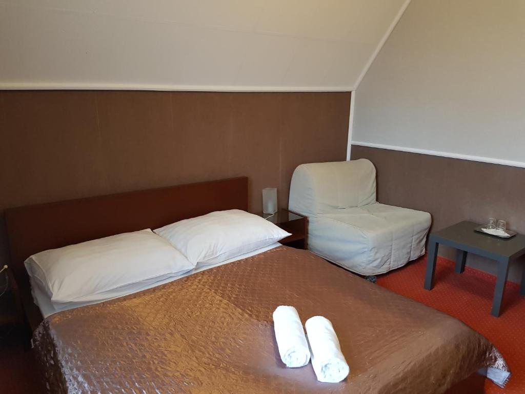 Postel nebo postele na pokoji v ubytování Amaretto Szállás