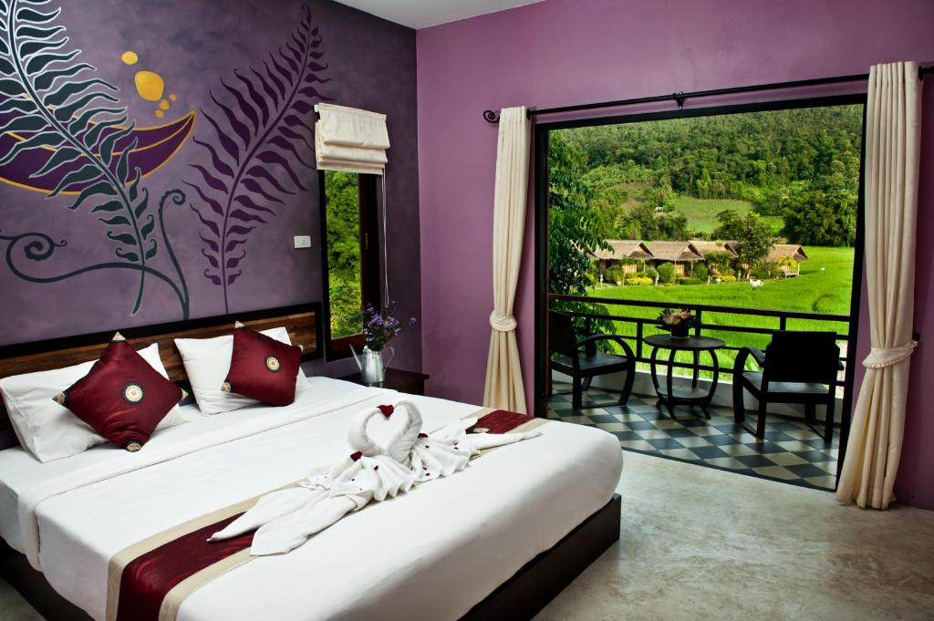 Postel nebo postele na pokoji v ubytování Pai Vieng Fah Resort