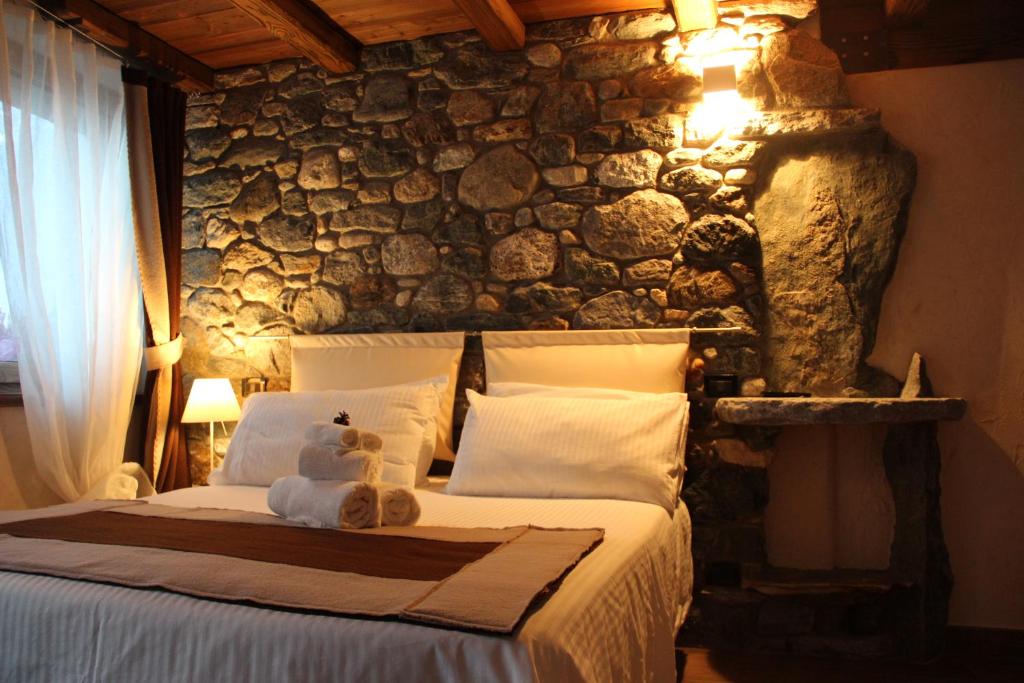Postel nebo postele na pokoji v ubytování B&B Lo Matsòn