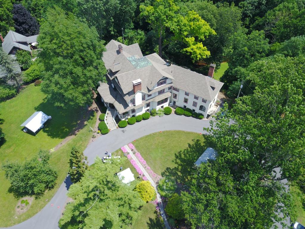an aerial view of a large house in the trees at The Inn at Ragged Edge in Chambersburg