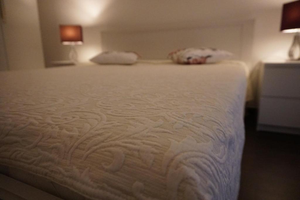 a close up of a bed in a room at Apartment Kozina in Podstrana