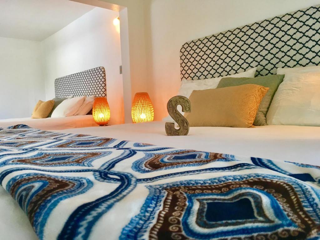 Postel nebo postele na pokoji v ubytování Serenity Rincon Guesthouse