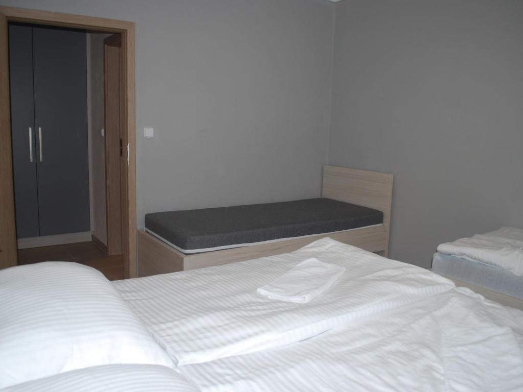 Postel nebo postele na pokoji v ubytování Apartmán U Zámku