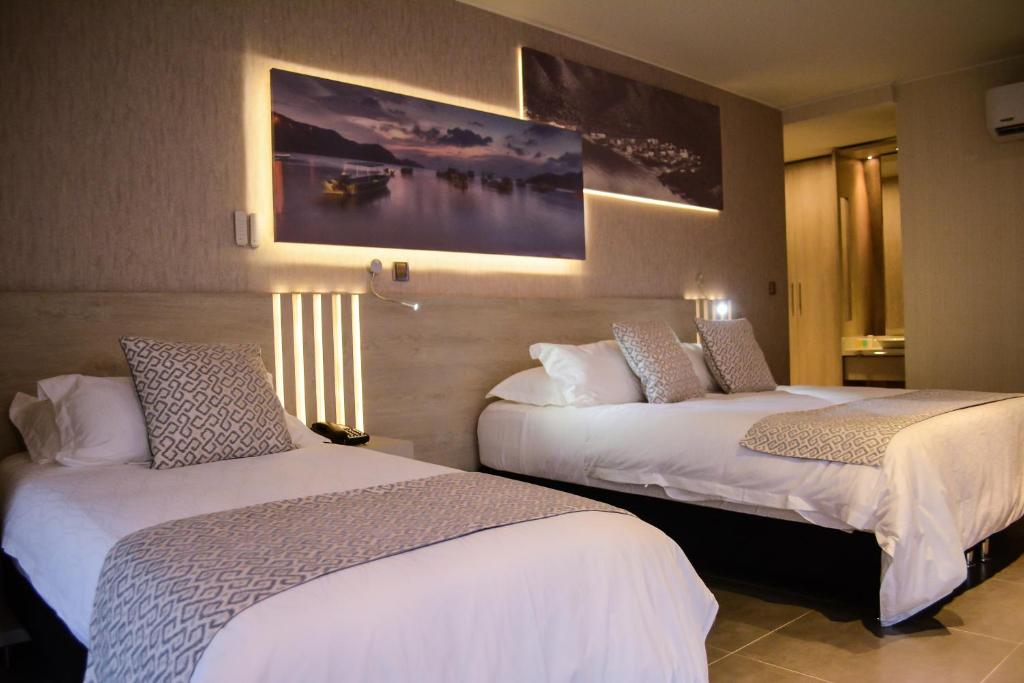 
Un ou plusieurs lits dans un hébergement de l'établissement Perla Suite Hotel
