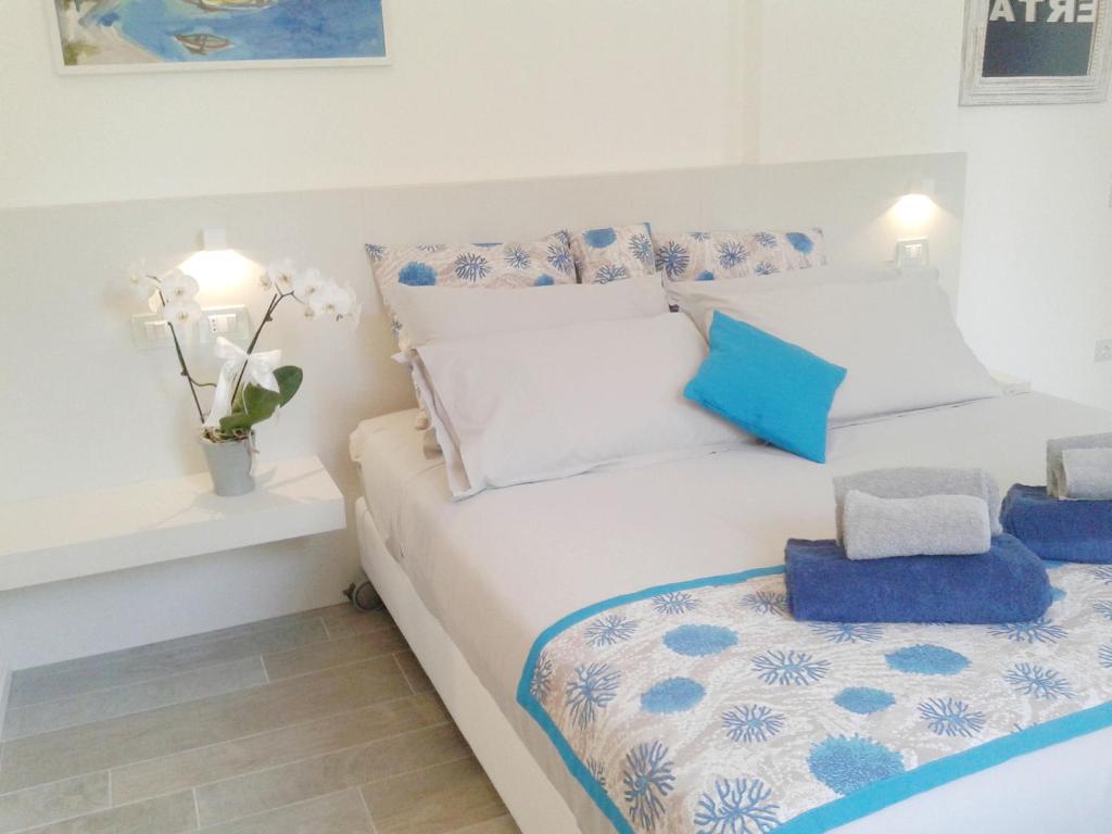 Postel nebo postele na pokoji v ubytování Hotel Madalù