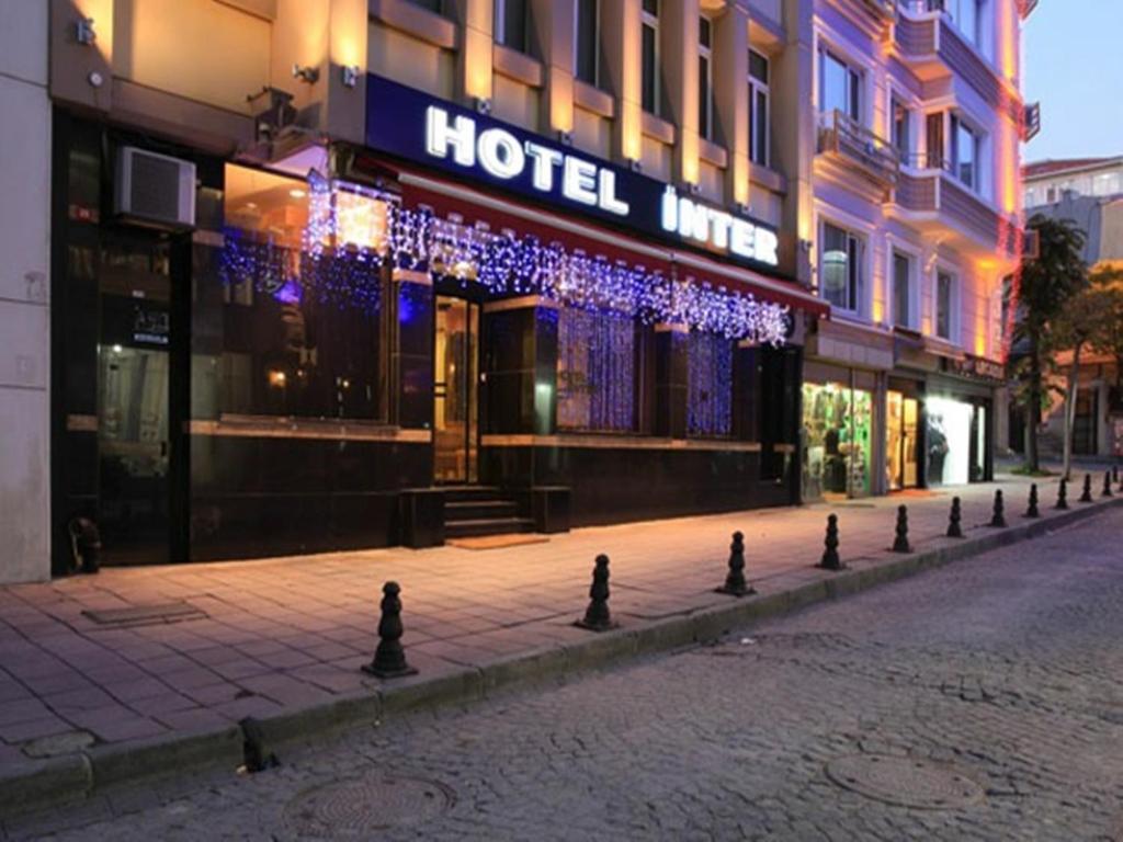 an empty street with a hotel in front of a building at Hotel Inter Istanbul in Istanbul