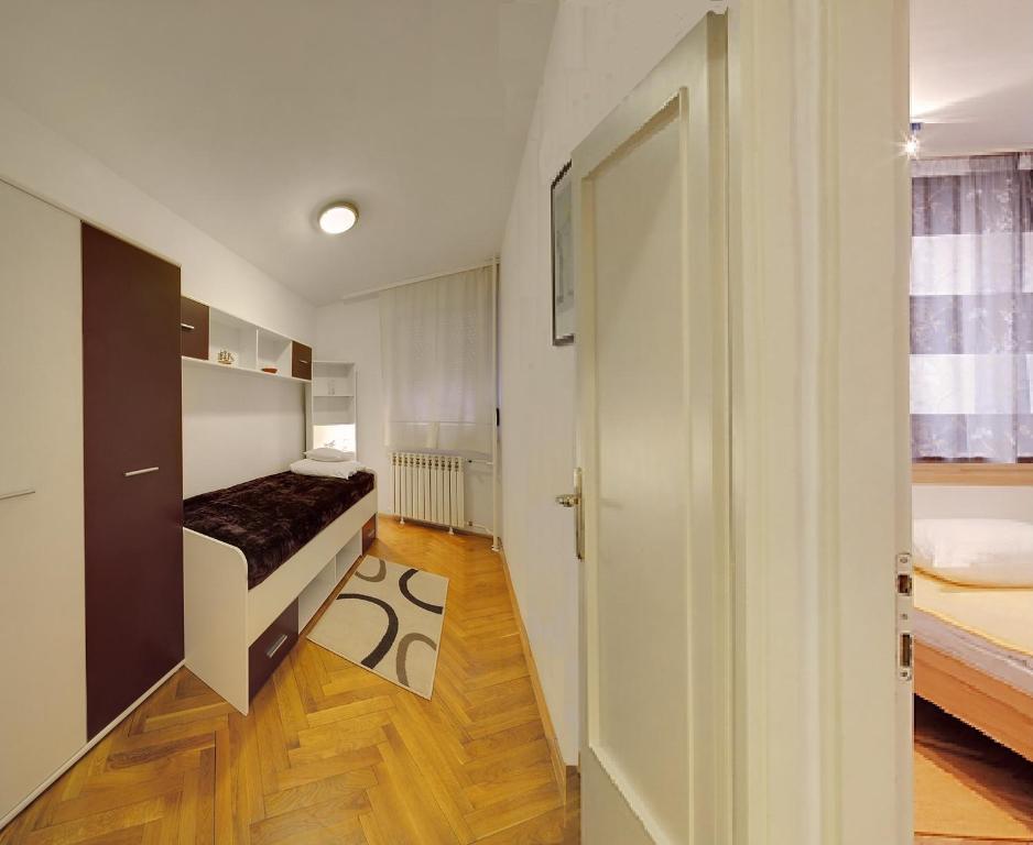 Postel nebo postele na pokoji v ubytování Apartman Osijek