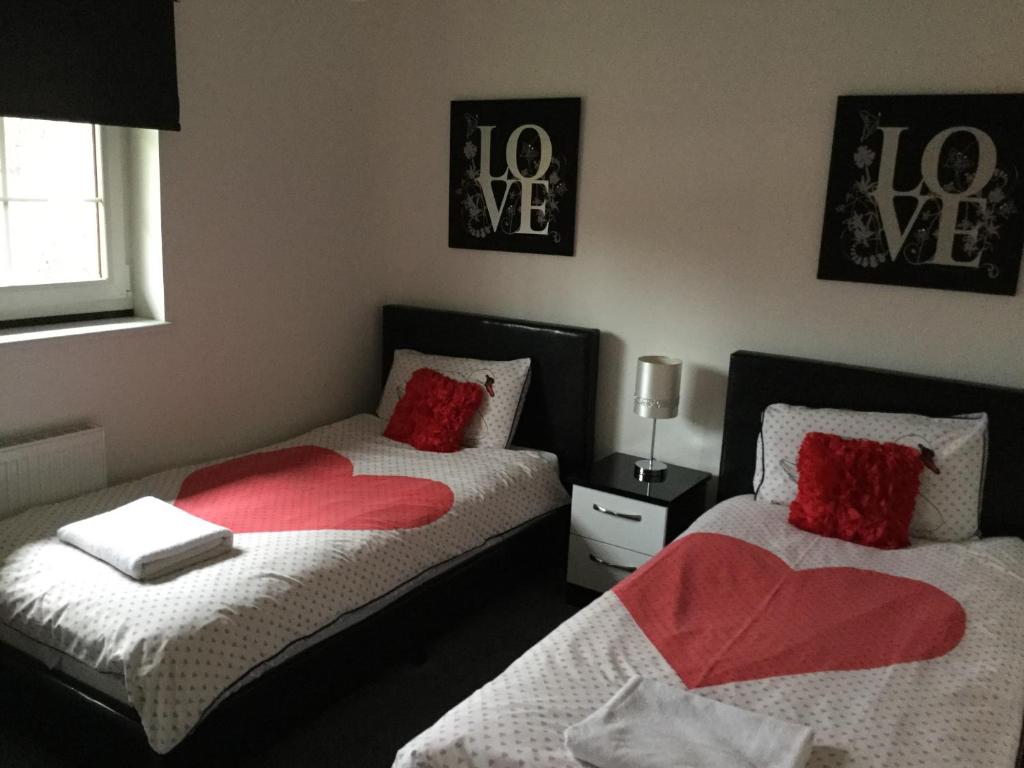 Postel nebo postele na pokoji v ubytování La Fortuna Lodges