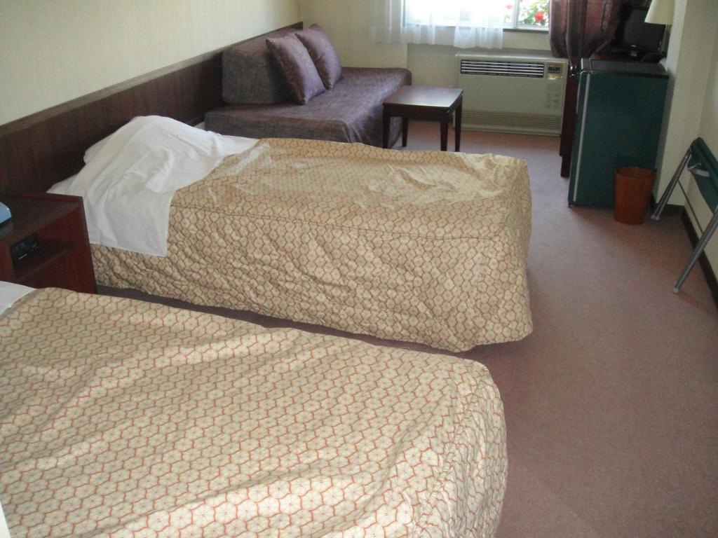 Postel nebo postele na pokoji v ubytování Hotel Weisser Hof Happei