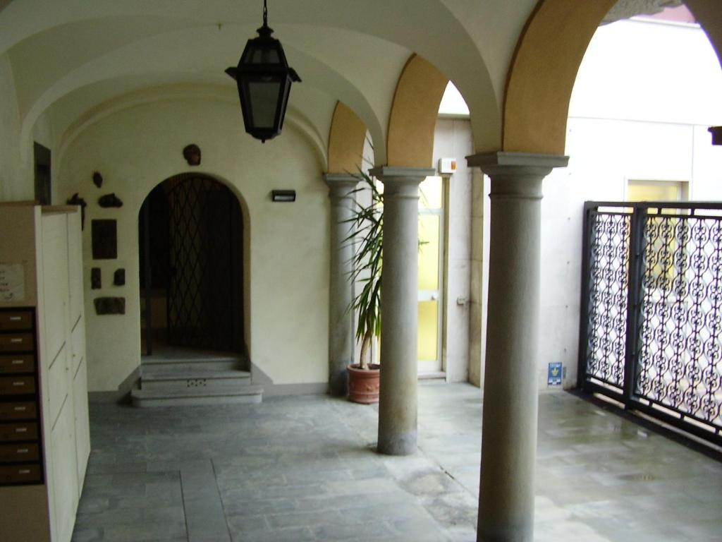 a hallway of a building with a potted plant at La Castellana in Bergamo