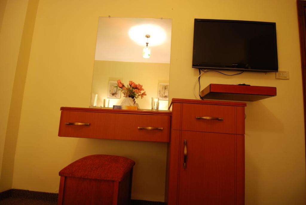 TV a/nebo společenská místnost v ubytování Al Rashid Hotel