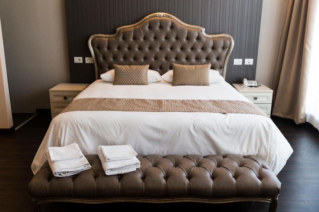 Posteľ alebo postele v izbe v ubytovaní Hotel Datini